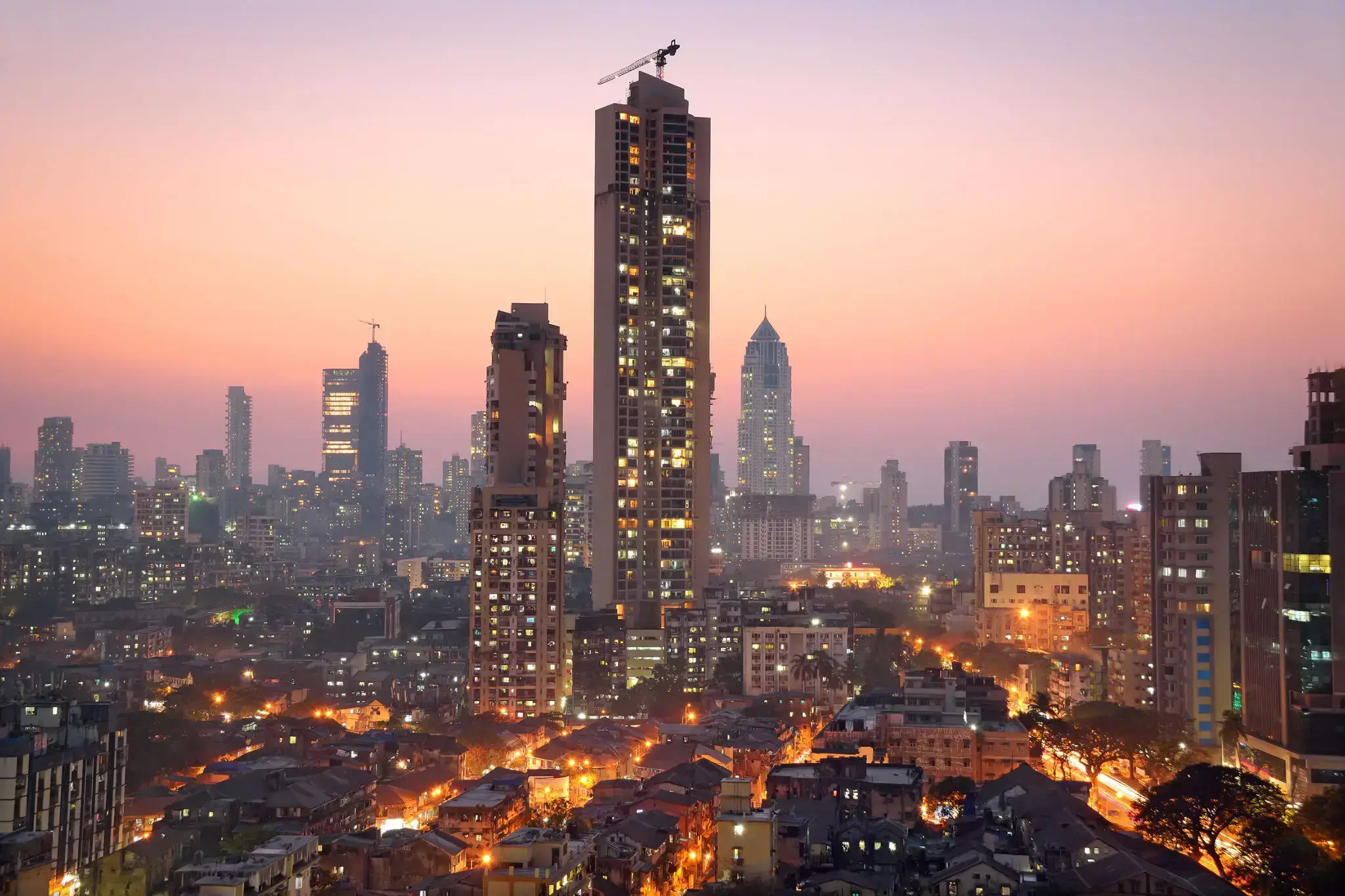 City skyline with tall buildings at dusk.
